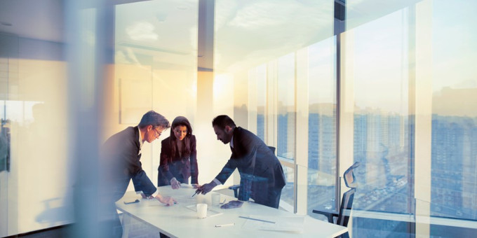 People working over a desk