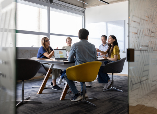 Workers at a conference table